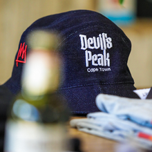 Load image into Gallery viewer, Tshepo x Devil's Peak 5-Panel Drawstring Hat.